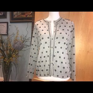 A designer cardigan with stones embellishments